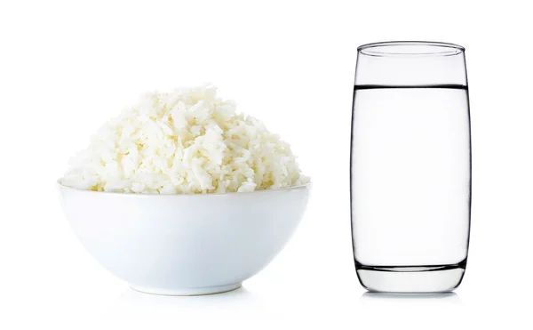 Rice with bowl and water of glass isolated on white 
