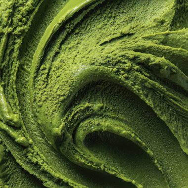 Kıvrımlı yeşil kibrit tozu ve kremalı dondurmanın detaylı dokusu canlı rengini ve zengin dokusunu sergiliyor.