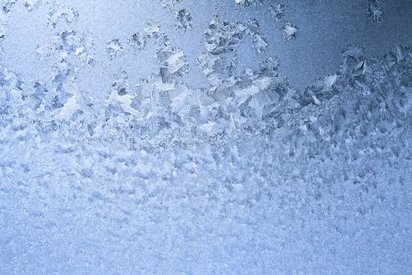 Padrão gelado azul em vidro — Fotografia de Stock