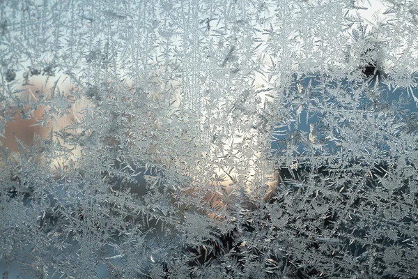 Blauwe frosty patroon op glas — Stockfoto