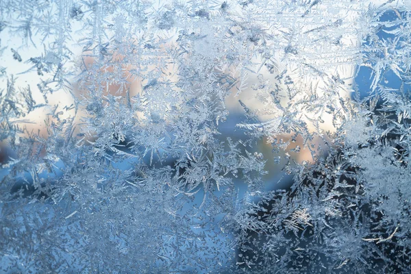 Blue frosty pattern on glass — Stock Photo, Image