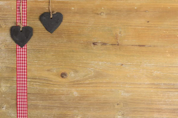 Heart of slate on a wood panel. — Stock Photo, Image