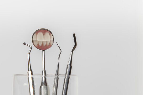 Set of dentists tools in a glass