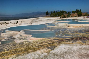 Panoramic view of the ancient Roman baths of Pamukkale (Anatolia, Turkey). Next to the Roman ruins of Hierapolis. Natural terraces. 