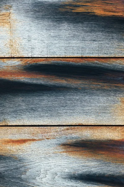 Mavi ve turuncu renkli eski paslı ahşap panel