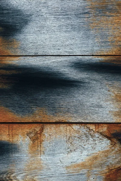 Mavi ve turuncu renkli eski paslı ahşap panel