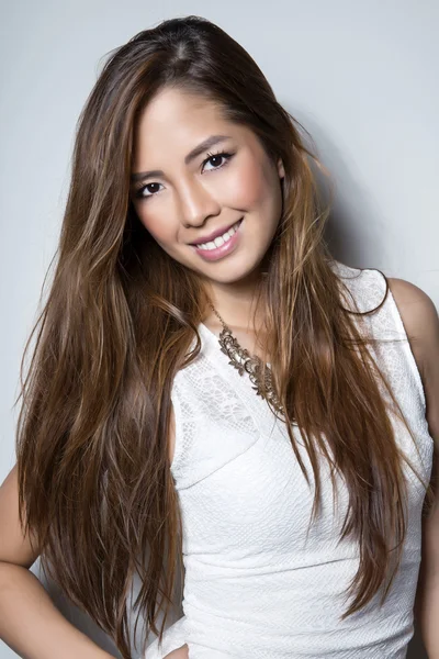 Beautiful asian young woman in white dress with flawless skin — Stock Photo, Image