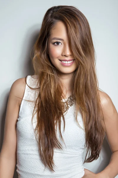 Beautiful asian young woman in white dress with flawless skin — Stock Photo, Image