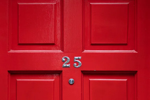 Деталь Красной Двери Номером Глазок Лицензионные Стоковые Изображения