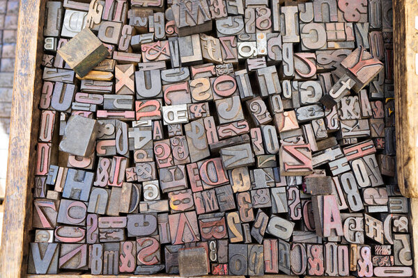 Wooden box full of letterpress with many sizes and shapes