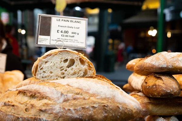 Beautiful fresh french loaf of bread in a farmer\'s market stand