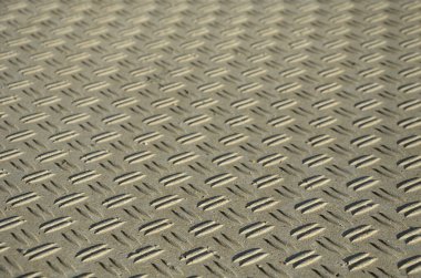 concrete monolith staircase with the texture of extruded ribbed, corrugated sheet metal. ramp with vegetation of ornamental dry grasses and perennials tin edge curb