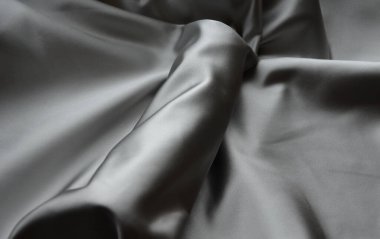 erect male penis under a satin cloth blanket. gift vibrator covered chastely. the usual Valentine's gift and a frequent offer of sex shops. The greatness of male nature will be replaced by a silicone dildo, a topic for conversation and bed games