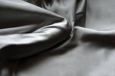 erect male penis under a satin cloth blanket. gift vibrator covered chastely. the usual Valentine's gift and a frequent offer of sex shops. The greatness of male nature will be replaced by a silicone dildo, a topic for conversation and bed games