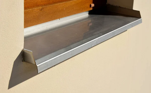 plating the sill with stainless steel sheet is forever. steel does not lose its quality and the sun does not whiten it like color. Under the window water dripping from the window to the ground, water