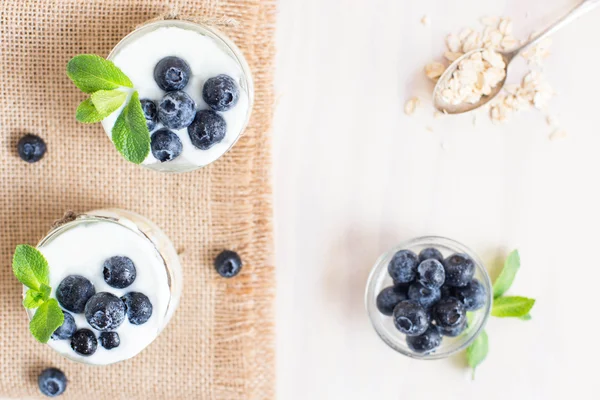 Blueberry yogurt in a glass. Healthy breakfast. Close up. Eye bird view.