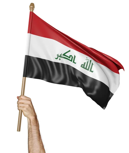 イラクの国旗を誇らしげに手を振っている手 — ストック写真