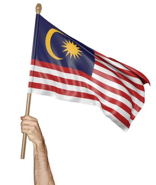 Mano sventola orgogliosamente la bandiera nazionale della Malesia — Foto Stock