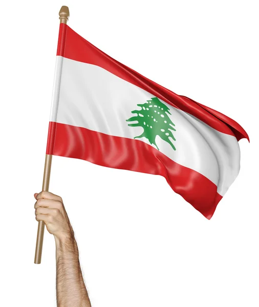 Main agitant fièrement le drapeau national du Liban — Photo