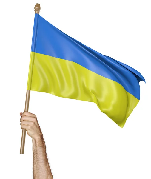 Hand proudly waving the national flag of Ukraine — Stock Photo, Image