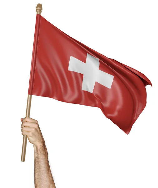 Hand proudly waving the national flag of Switzerland — Stock Photo, Image