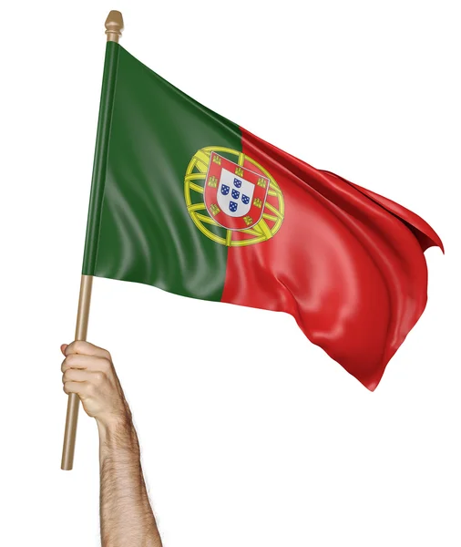 Mão orgulhosamente acenando com a bandeira nacional de Portugal — Fotografia de Stock