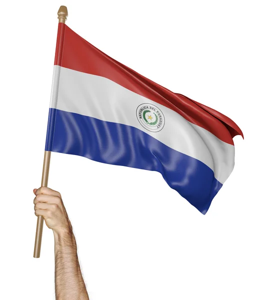 Mano orgullosamente ondeando la bandera nacional de Paraguay — Foto de Stock