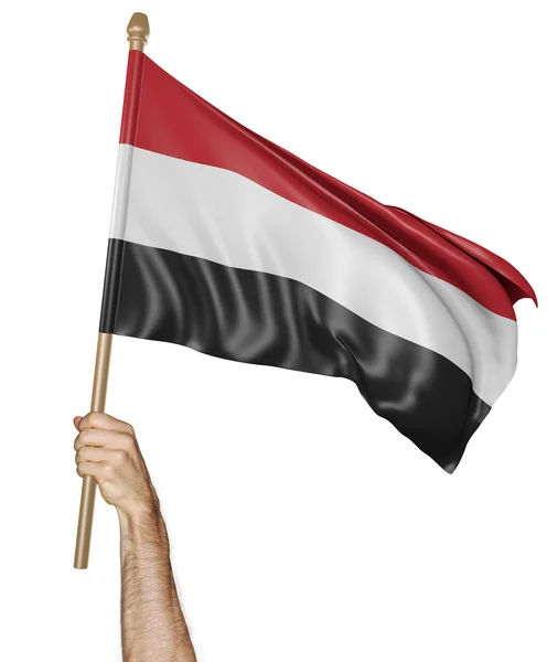 イエメンの国旗を誇らしげに手を振っている手 — ストック写真