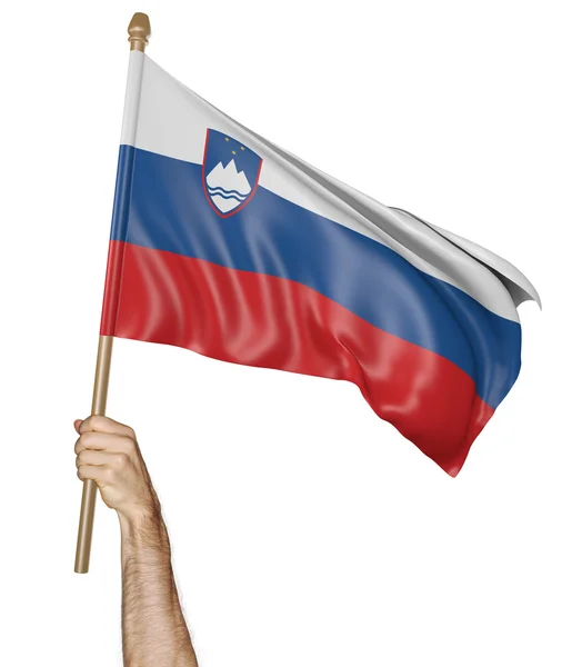 Mão orgulhosamente acenando a bandeira nacional da Eslovênia — Fotografia de Stock