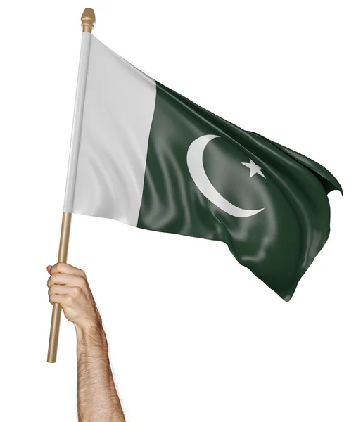Ruka hrdě mává státní vlajka Pákistánu — Stock fotografie