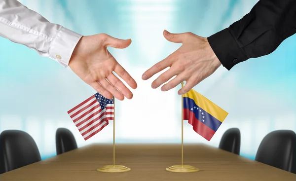 Vereinigte staaten und venezuela diplomaten schütteln hände, um eine vereinbarung zu vereinbaren, teil 3d rendering — Stockfoto