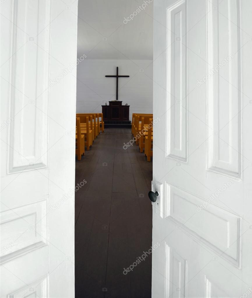 Church doors opening to the sanctuary