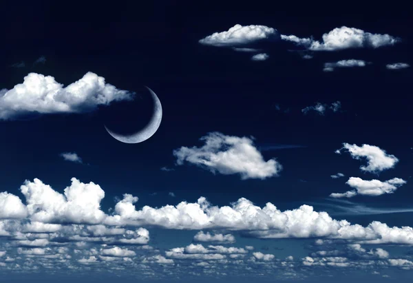 Crescent moon in dreamy night sky and clouds — Stock Photo, Image