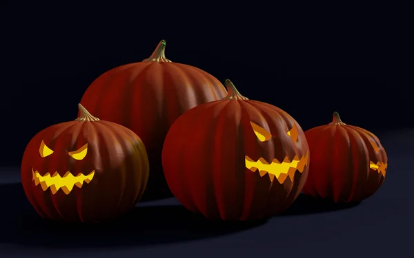 Spooky Halloween Jack-o-lanternes avec des visages maléfiques luisant dans l'obscurité — Photo