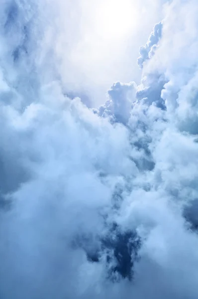 Heavenly blue and white clouds softly backlit by light — Stock Photo, Image