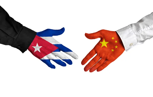 Cuban and Chinese leaders shaking hands on a deal agreement — Stock fotografie