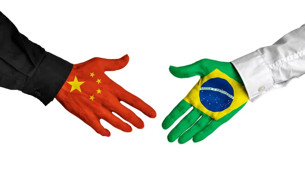 China and Brazil leaders shaking hands on a deal agreement — Stock Photo, Image