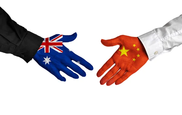 Australia and China leaders shaking hands on a deal agreement — Stock Photo, Image