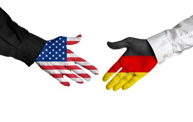 Amerika Birleşik Devletleri ve Almanya liderleri bir anlaşma üzerinde anlaşmaya tokalaşırken