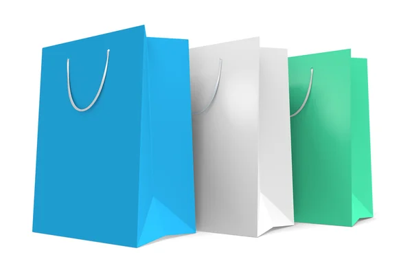 Three paper shopping bags with a teal and white color theme — Stock Photo, Image