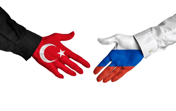 Führende Politiker der Türkei und Russlands schütteln die Hand über ein Abkommen — Stockfoto