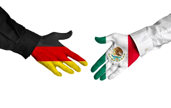 Лидеры Германии и Мексики пожимают руку соглашению о сделке — стоковое фото