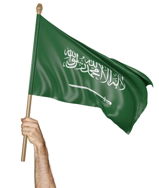 Main agitant fièrement le drapeau national de l'Arabie Saoudite — Photo