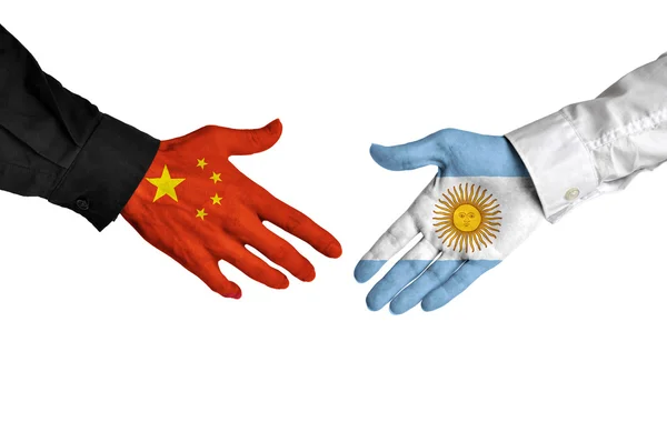 China and Argentina leaders shaking hands on a deal agreement — Stock Photo, Image