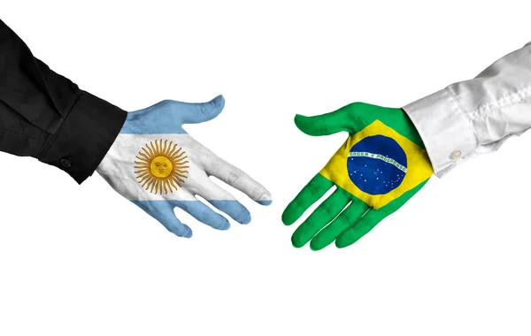 Argentina and Brazil leaders shaking hands on a deal agreement — Stock Photo, Image