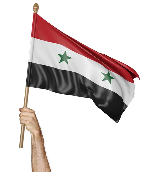 Hand proudly waving the national flag of Syria — Stock Photo, Image