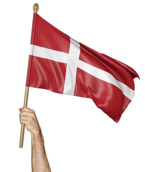 Mão orgulhosamente acenando a bandeira nacional da Dinamarca — Fotografia de Stock