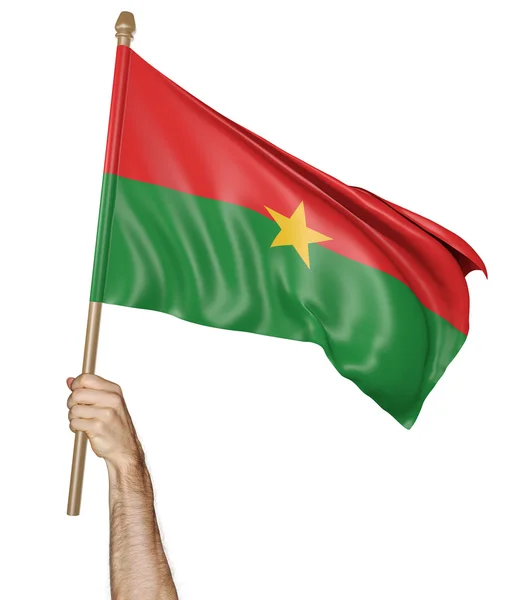 Mano orgullosamente ondeando la bandera nacional de Burkina Faso —  Fotos de Stock