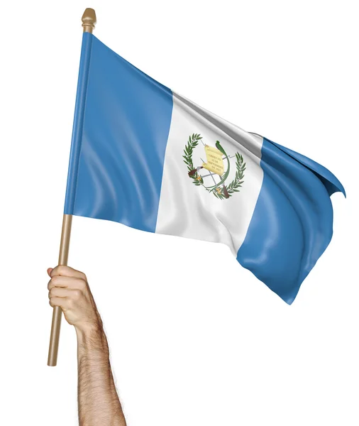 Mano orgullosamente ondeando la bandera nacional de Guatemala — Foto de Stock
