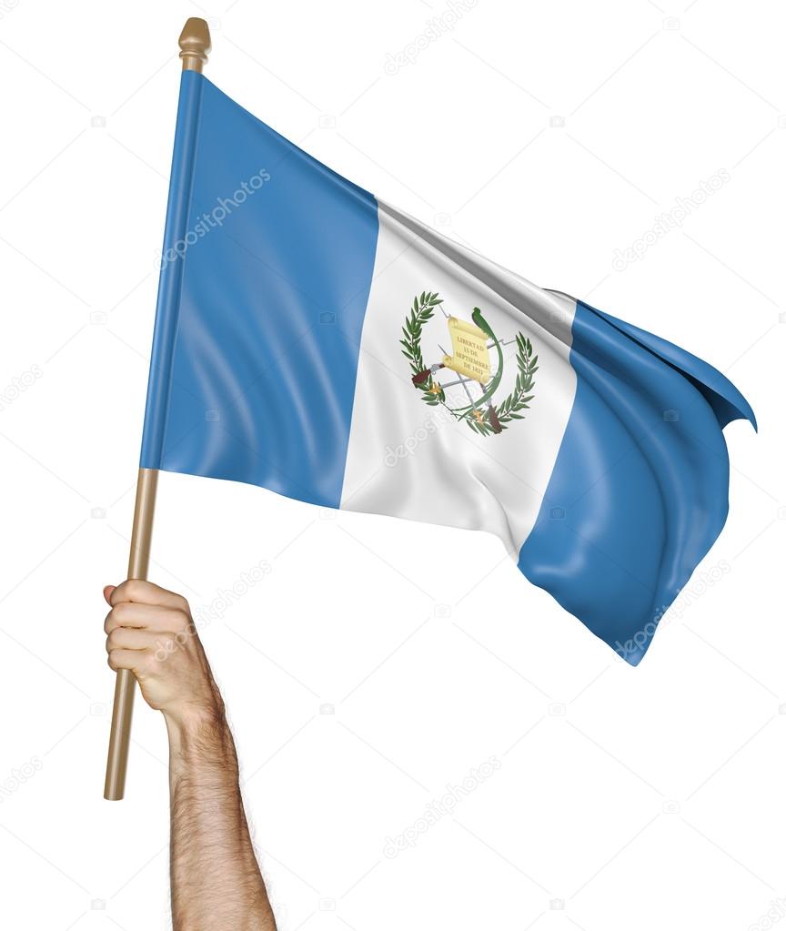 Hand proudly waving the national flag of Guatemala